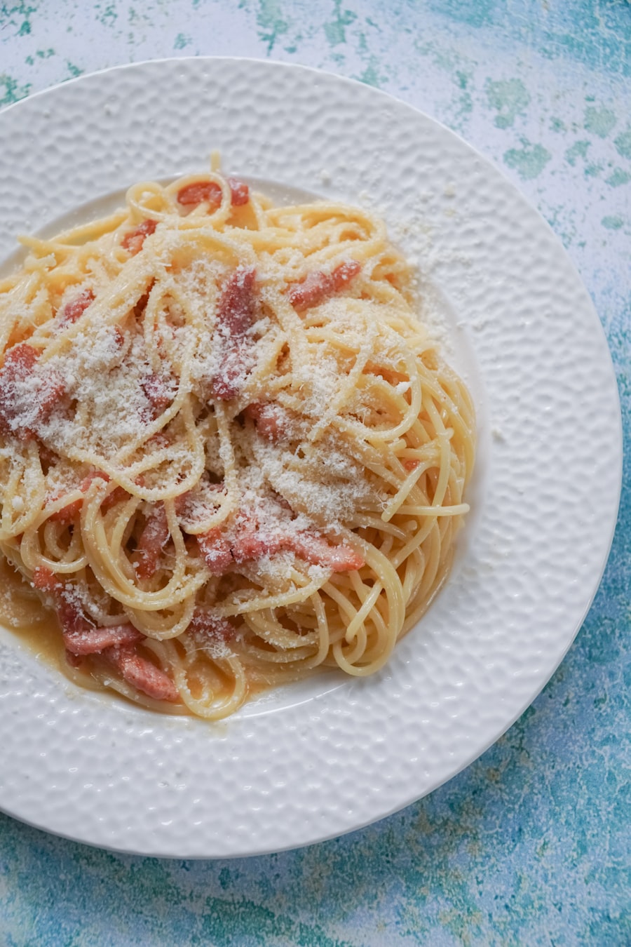 Bowl of spaghetti carbonara, low light