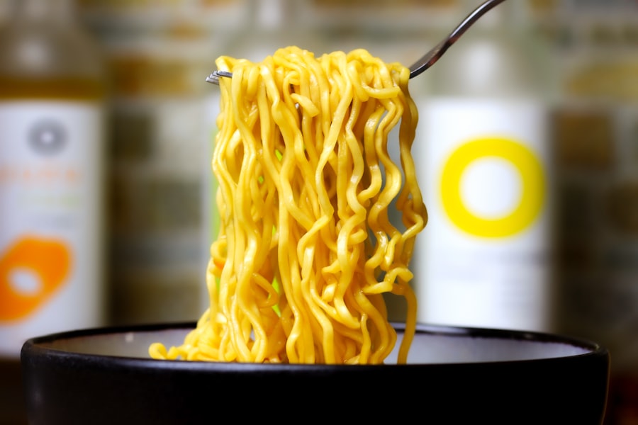 Bowl of noodles with broth and herbs